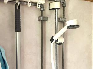 a shower with two lights on a wall at 2 person holiday home in ÖDESHÖG in Ödeshög