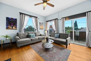 a living room with a couch and a table at Riverview Escape in Walkable Historic District in Jeffersonville
