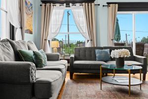 a living room with two couches and a table at Riverview Escape in Walkable Historic District in Jeffersonville +98 photos