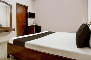 Postel nebo postele na pokoji v ubytování Hotel O Golden