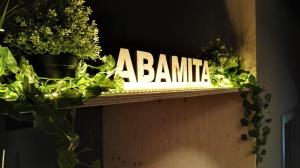 a sign that says banana on a shelf with plants at Casa Abamita in Barcelona