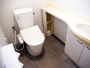 Koupelna v ubytování 元気な宿 片貝
