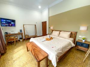 Muni Residence & Spa客房内的一张或多张床位