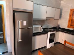 Köök või kööginurk majutusasutuses Casa aconchego em Foz do Iguaçu +5 fotot