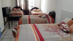 Postel nebo postele na pokoji v ubytování Hostal Almagro
