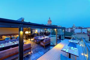 a restaurant on the roof of a building at Walton Hotels Galata in Istanbul