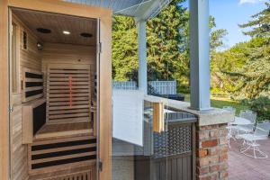 a hot tub on a house with a patio at Gardenview Estate Bed and Breakfast in Kettle Falls
