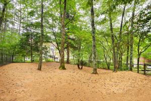 a group of trees in a park with a fence at Wan Wan Paradise Takayama in Takayama +36 photos