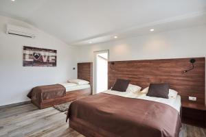 Postel nebo postele na pokoji v ubytování Apartments Tre Perle