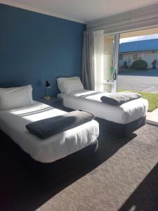Postel nebo postele na pokoji v ubytování Lake Dunstan Motel