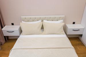 Postel nebo postele na pokoji v ubytování ЖК Respublica