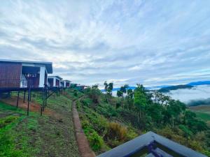 a house on top of a hill with a view at Swiss Hill View in Phop Phra