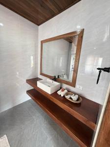 a bathroom with a sink and a mirror at Nam ou view villa in Nongkhiaw +100 photos