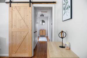 a sliding door in a room with a hallway at Play & Stay Dallas Home w Gym Gameroom WiFi in Dallas