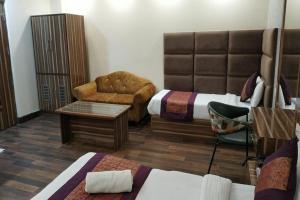 Postel nebo postele na pokoji v ubytování HOTEL SINGH CONTINETAL