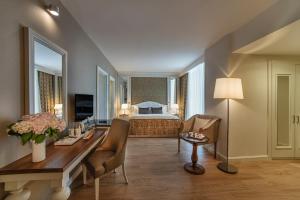 A bed or beds in a room at Aska Lara Resort & Spa Hotel