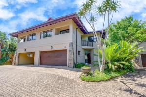 an image of a house with a garage at Baluwatu 10, Zimbali Estate by Euphoric Leisure in Ballito