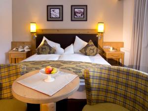 Postel nebo postele na pokoji v ubytování Hotel Bergkristall