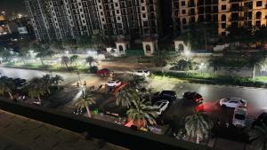 an aerial view of a parking lot at night at Aura Stays in Lucknow
