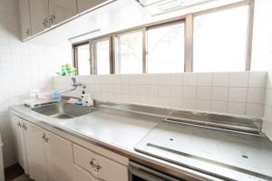 a kitchen with a sink and a window at Peace Branch in Yonabaru +119 photos