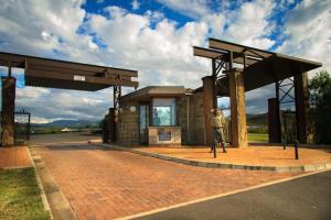 a man standing in front of a gas station at Aleah, Cathkin Estates by Euphoric Leisure in Champagne Valley