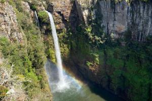 an aerial view of a waterfall in a canyon at Aleah, Cathkin Estates by Euphoric Leisure in Champagne Valley