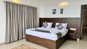 Postel nebo postele na pokoji v ubytování Veu Munnar Retreat - Valley View Rooms