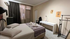 Postel nebo postele na pokoji v ubytování Guest House Kldiashvili