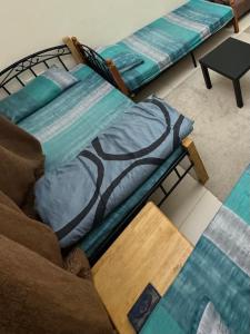 Postel nebo postele na pokoji v ubytování سكن شباب بالتعاون - ALEX Hostel - Sharjah