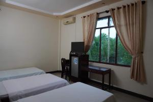 Katil atau katil-katil dalam bilik di Bình Sơn Hotel - Khách sạn tại Dung Quất