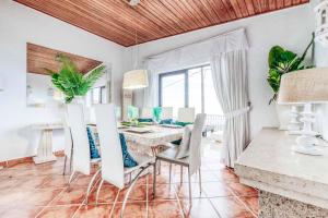 a dining room with a table and chairs at Villa Isabel Sol in Adeje