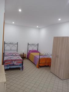 Ένα ή περισσότερα κρεβάτια σε δωμάτιο στο Casa marino monolocale