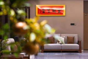 Posezení v ubytování Guyuan Golden Garden Hotel