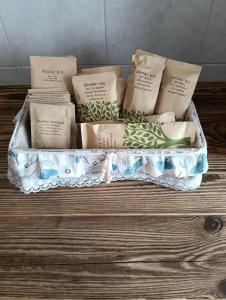 a tray filled with books on top of a wooden table at Casa Lodolo Lessona in Lessona +16 photos