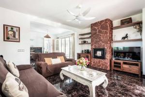 a living room with a couch and a table at Bell Veure in Ciutadella