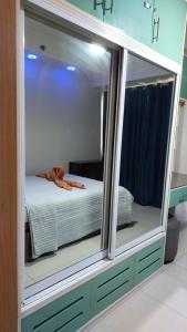 Ένα ή περισσότερα κρεβάτια σε δωμάτιο στο Shell residences