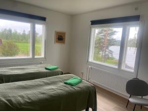 Postel nebo postele na pokoji v ubytování Napapiirin Eräkartano