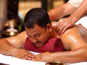 a man getting a massage in a hot tub at MOTHER TREE INN in Cochin