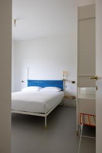 Postel nebo postele na pokoji v ubytování Casa Agrado - Atemporary Art Apartments