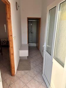 a hallway with a door leading into a room at Ranka1 Krk in Kornić