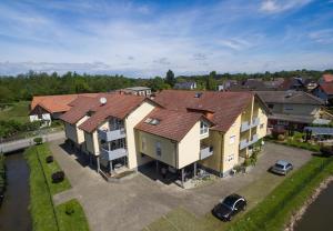 an overhead view of a large house with a parking lot at Ferienwohnung beim Europa-Park Rust in Rust