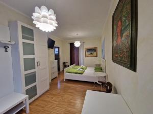a living room with a bed and a dining room at Residence Bed&Bike in Moggio Udinese +46 photos