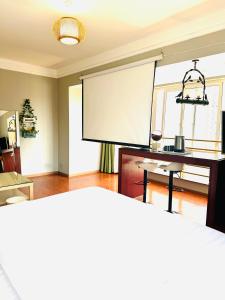 Postel nebo postele na pokoji v ubytování Chongqing Justom Family Apartment Hotel Jiaochangkou Branch