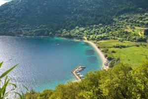 an aerial view of a beach in a body of water at Odyssey's Palace - Escape in Mythical Ithaca in Platithriás