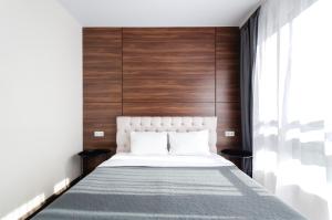 Posteľ alebo postele v izbe v ubytovaní Petrovdom Apartments 11-120 in RC Hoffman House, 34 Zolotoustivska Street
