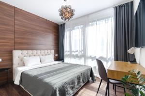 Posteľ alebo postele v izbe v ubytovaní Petrovdom Apartments 11-120 in RC Hoffman House, 34 Zolotoustivska Street