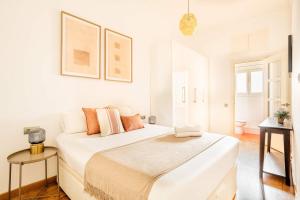 Postel nebo postele na pokoji v ubytování Pl Universitat Bright and cozy 2BD - 2BTH
