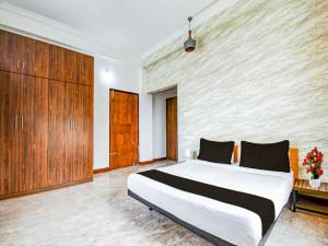 Postel nebo postele na pokoji v ubytování Super Hotel O Kalinganagar