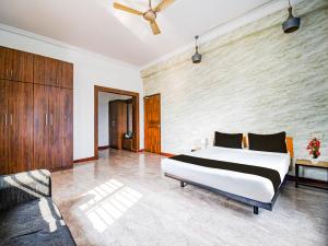 Postel nebo postele na pokoji v ubytování Super Hotel O Kalinganagar + 24 fotografií