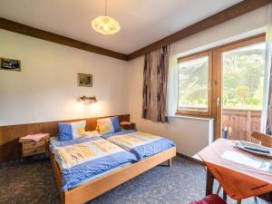 Posteľ alebo postele v izbe v ubytovaní Contemporary Apartment in Maishofen near Ski Area